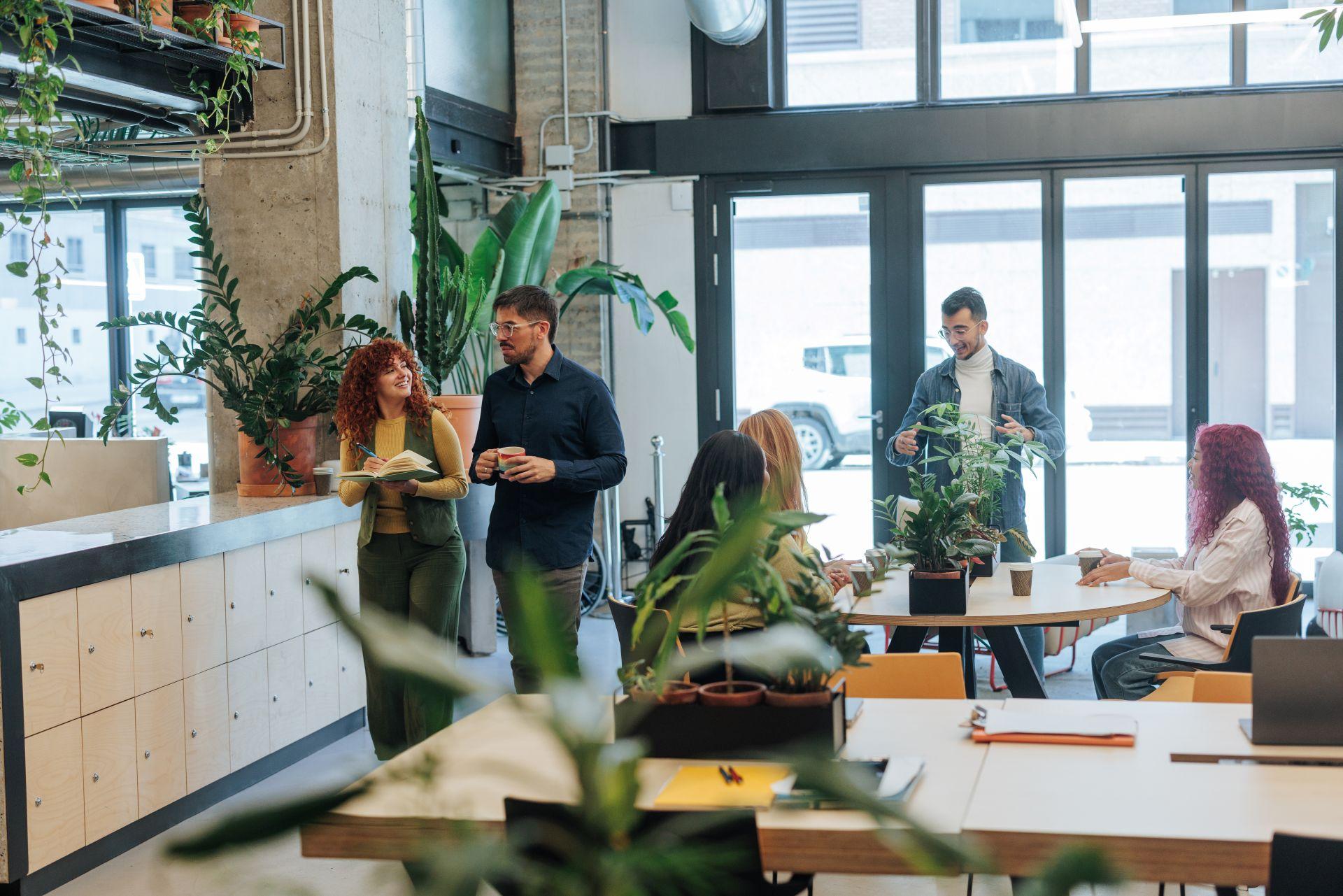 Creative team collaborating in a modern office space – symbolizing the hidden structures and teamwork behind creators and an onlyfans agency
