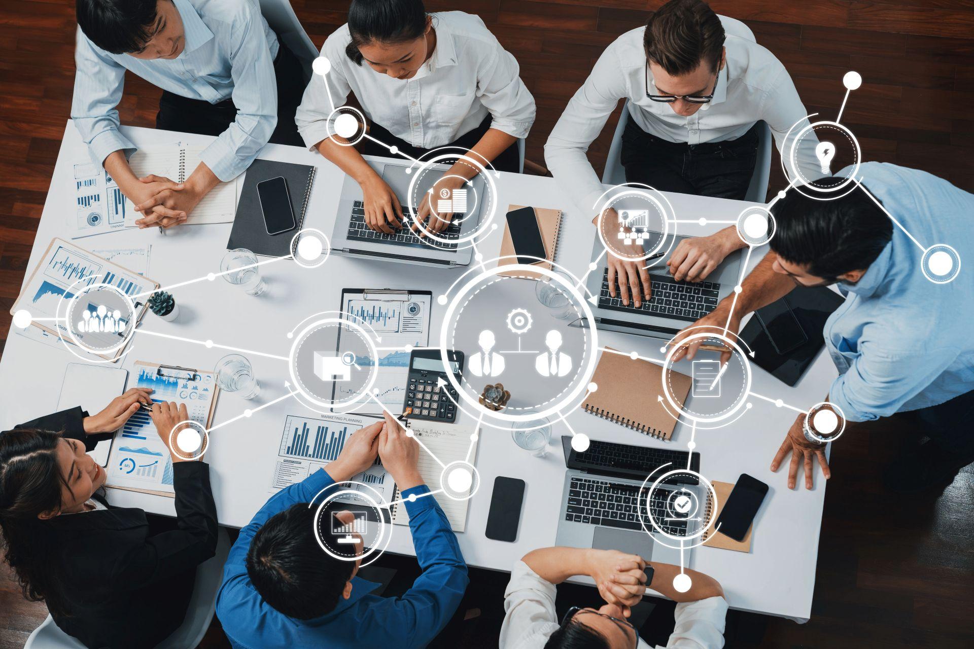 Overhead view of business team with digital network overlay – highlighting analytics, strategy, and collaboration supported by an onlyfans agency